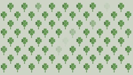 digital animation of multiple clover leaves flickering against grey background