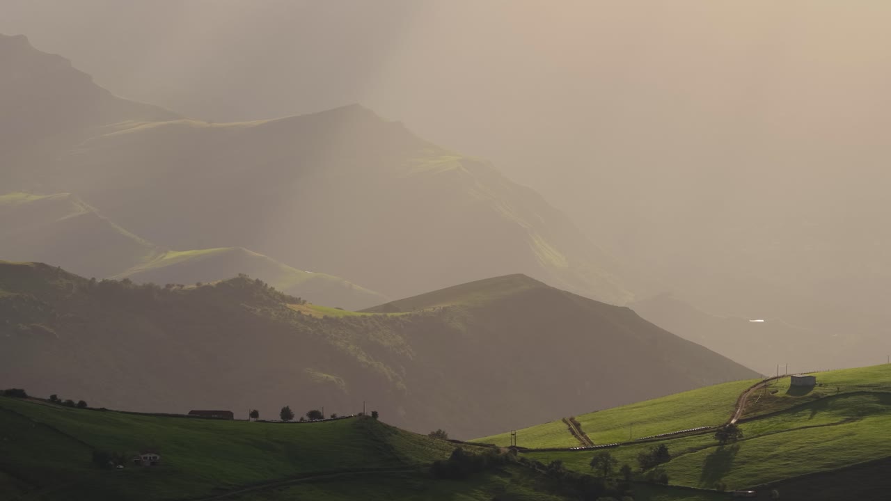 Sunbeams illuminate cantabria mountains in spain