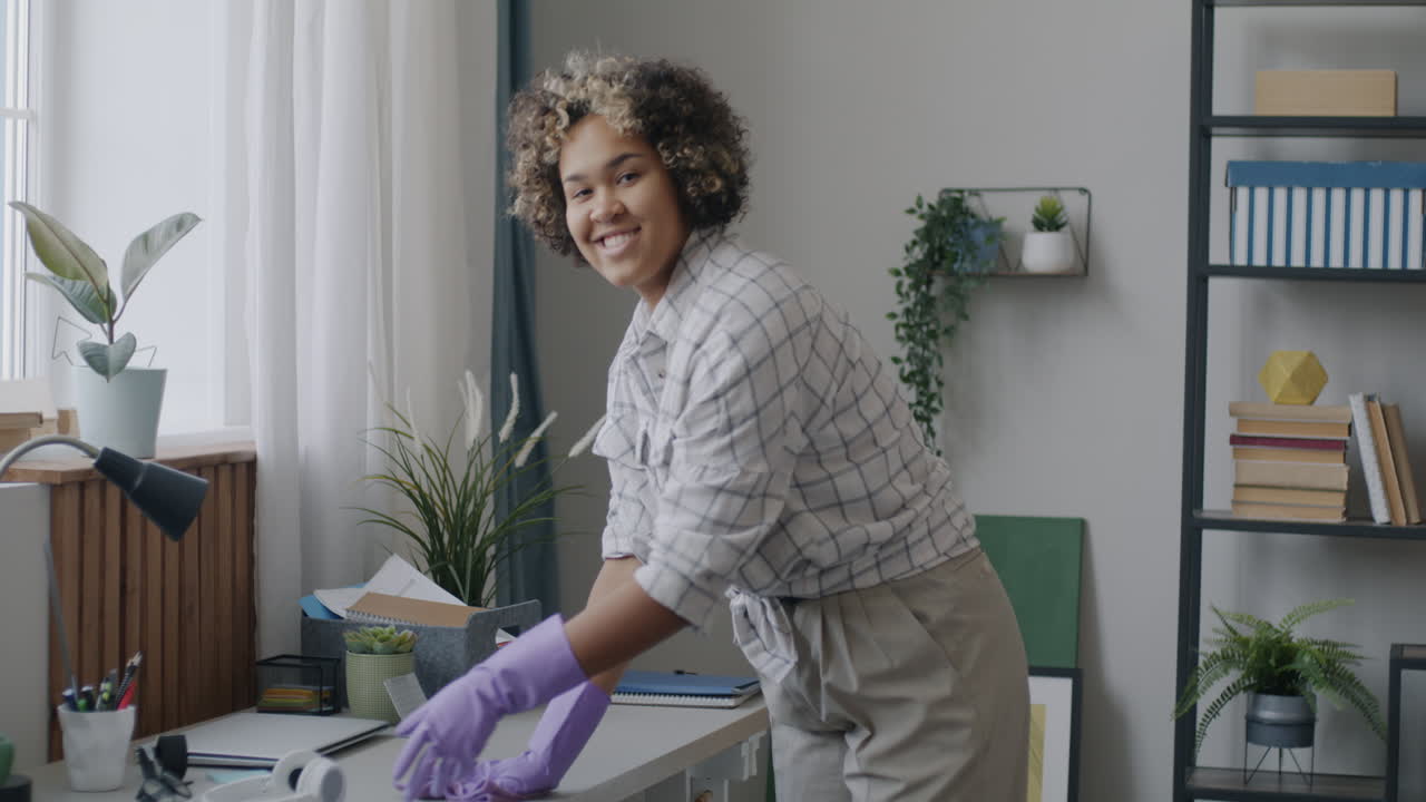 Woman cleaning her home office