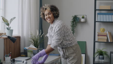 woman cleaning her home office