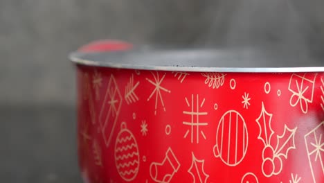 close-up of a red pot with christmas decorations