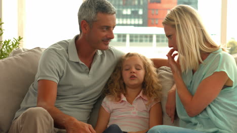 happy parents with their daughter
