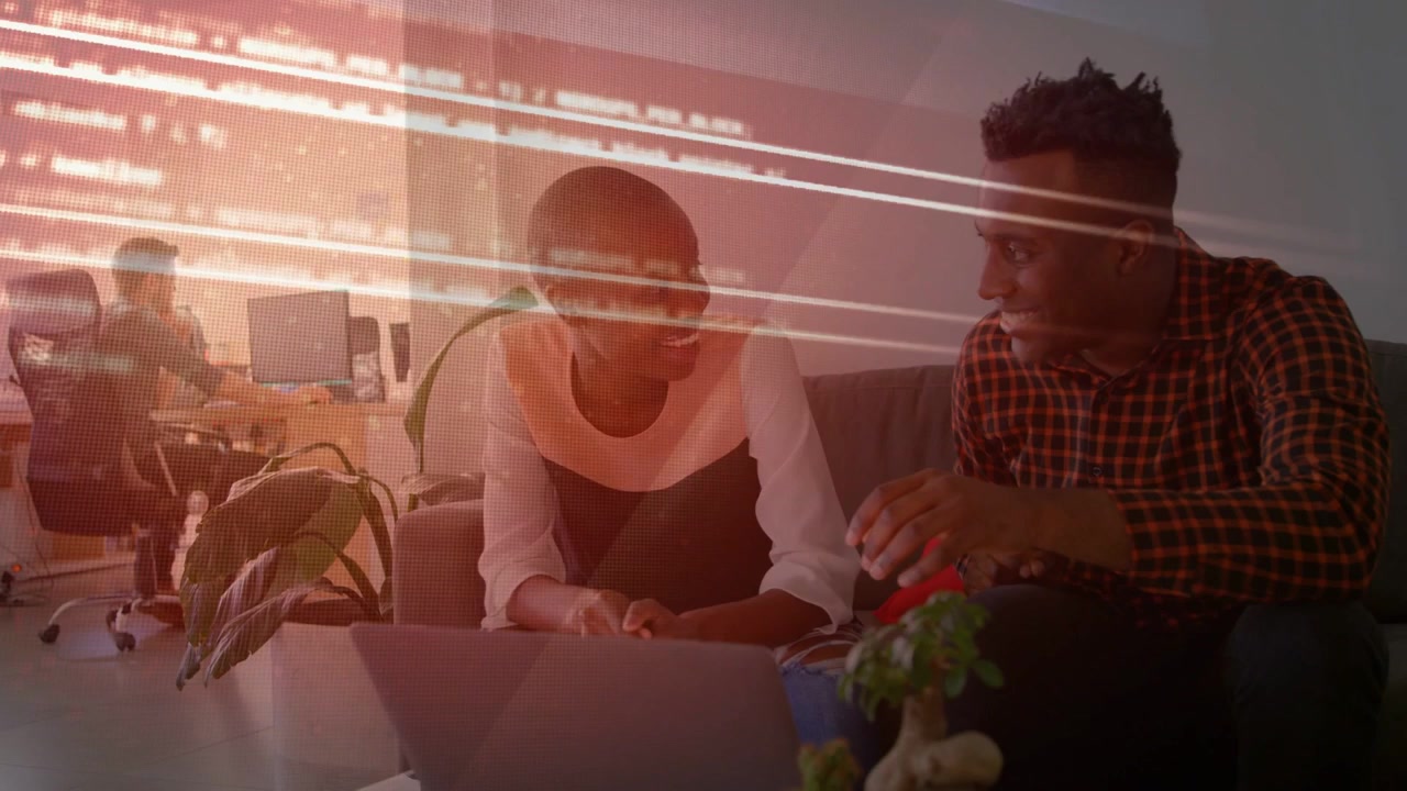 Business coworkers at laptop, woman gesturing causing Processing Data overlay leading agreement