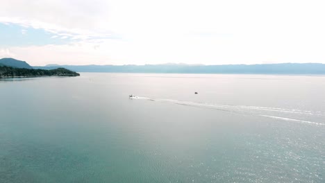Aerial-tracking-shot-of-boat-entering-a-by-on-Lake-Ohrid-in-Macedonia