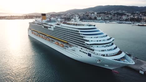 cruise ship in port at sunset