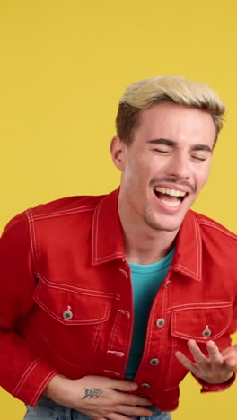 man laughing in red jacket
