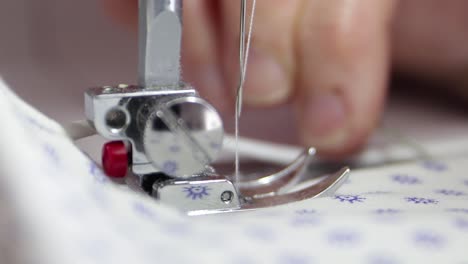 seamstress sewing a fabric face masks to prevent the coronavirus.- close up shot