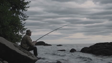 man fishing on the shore
