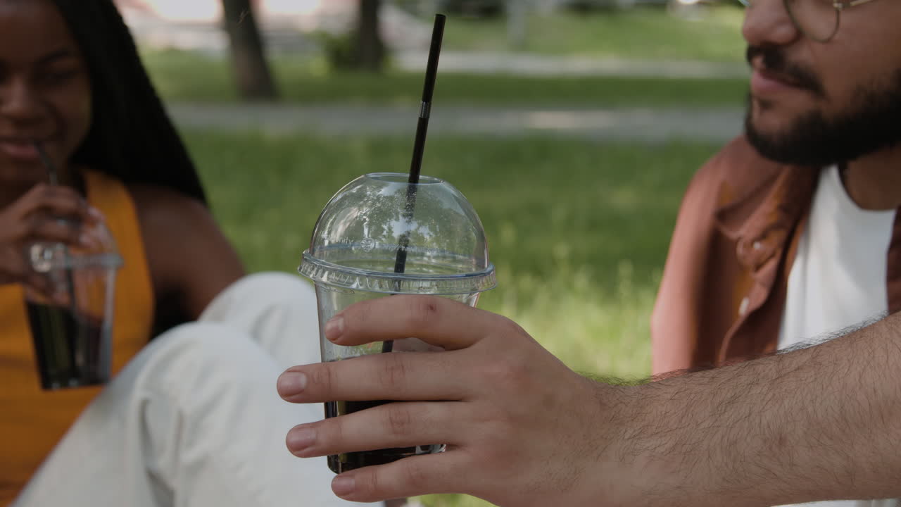 People enjoying drinks in a park