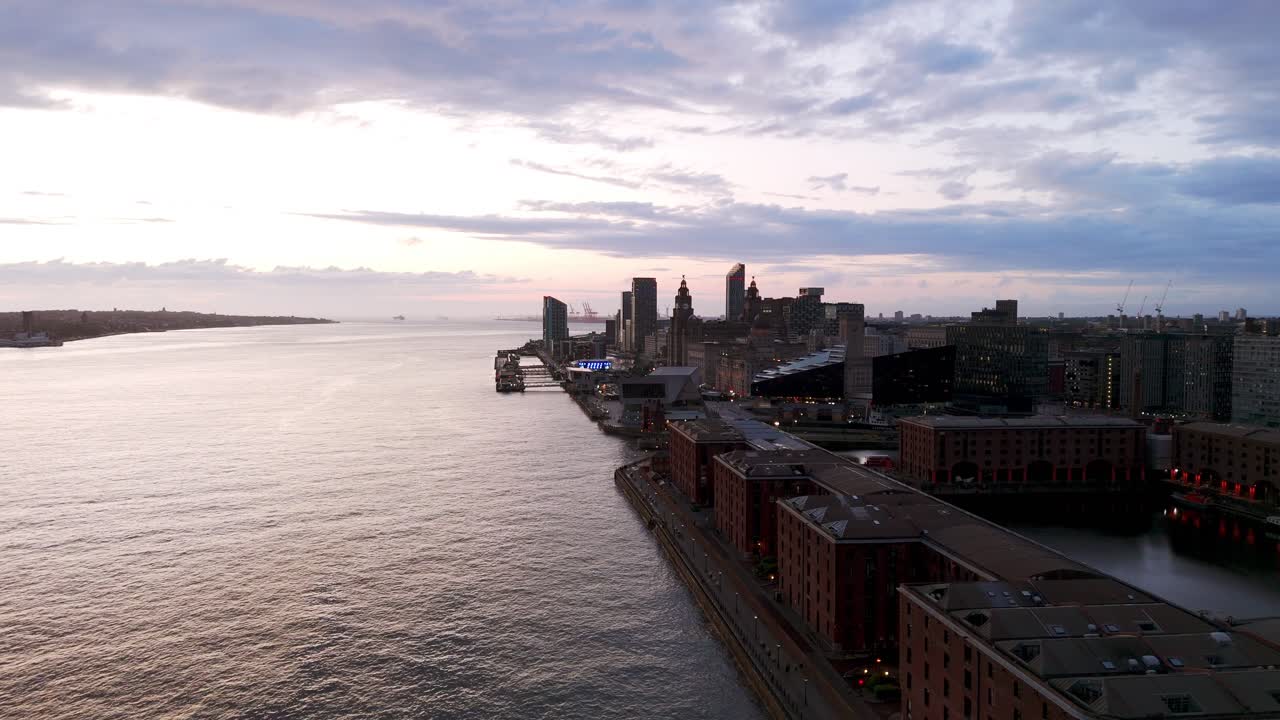 Aerial view of Liverpool cityscape at sunset showing Royal Albert Dock, River Mersey and commercial buildings