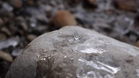 chunk of ice gets slammed on a rock