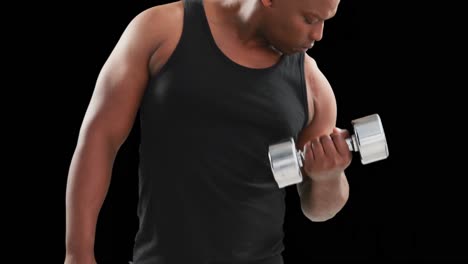 serious muscular man lifting dumbbells