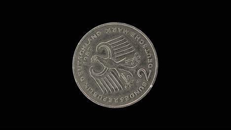 germany 2 deutsche mark reverse with german eagle and denomination, macro loop on black background