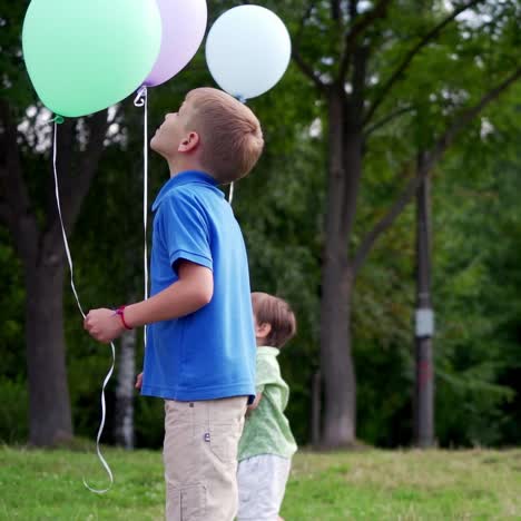 children playing with baloons. cute children celebrating birthday with baloons