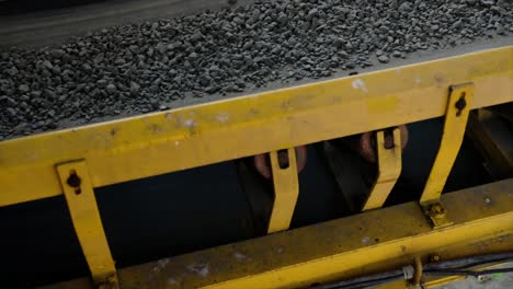 feeder supplies aggregate from the cold bin to the dryer via a conveyor belt