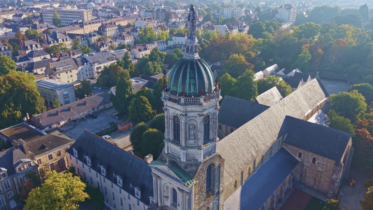 Approaching drone fly to the historic domed bell tower of Church of Our Lady of Saint Melaine aka Église Notre-Dame-en-Saint-Melaine in autumn, Rennes, Ille-et-Vilaine, France