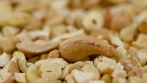 chopped cashew nuts on a rotating plate (seamless loopable)