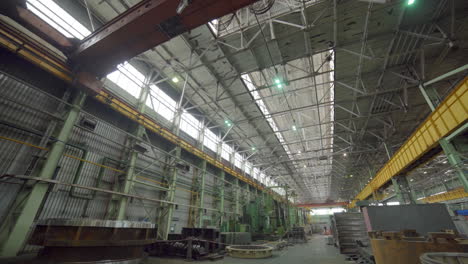 industrial factory interior with machinery and crane