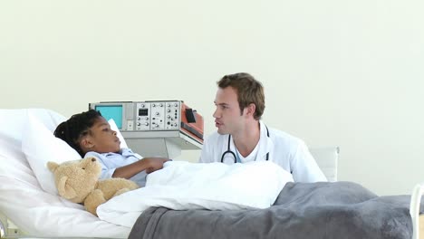 Positive-doctor-talking-with-a-little-boy