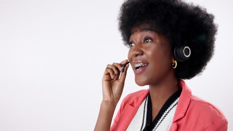 woman with afro and headphones