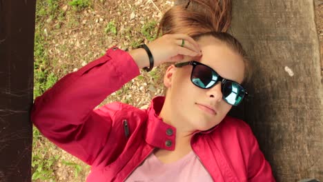 girl laying on the bench