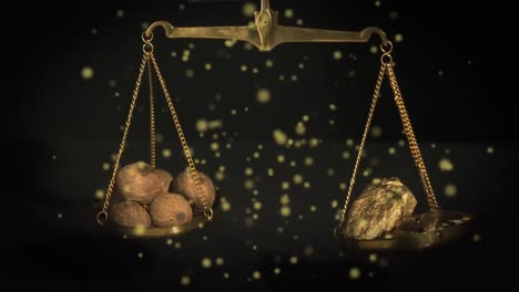 Animation-of-gold-and-walnuts-on-scales-and-glowing-spots-floating-on-black-background