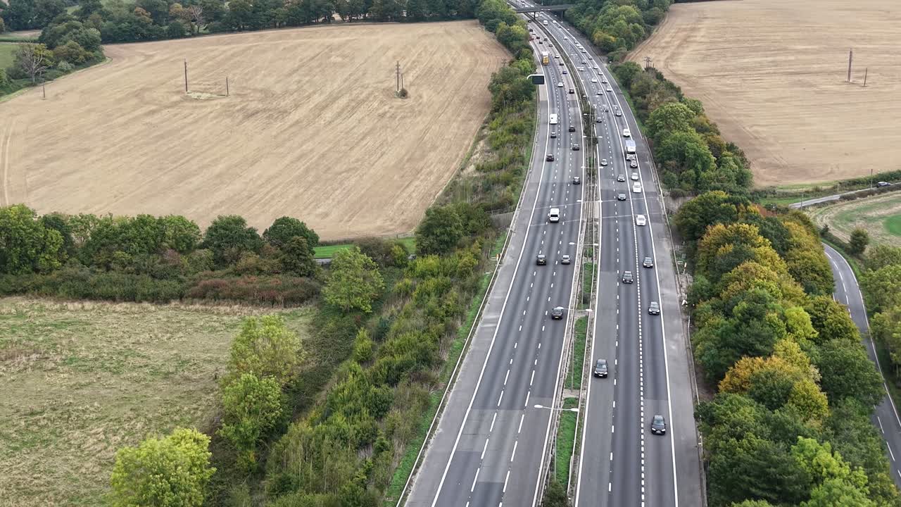 Traffic on M11 motorway Essex UK Overhead birds eye drone aerial view
