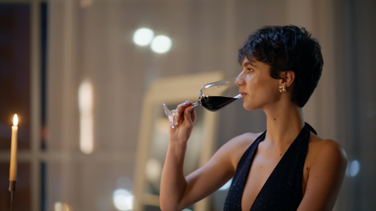 Boyfriend clinking wine smiling girlfriend in night flat closeup. Man toasting