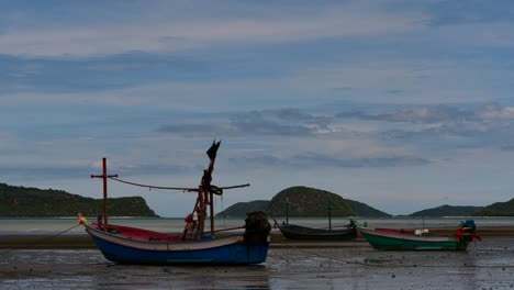 fishing boats mooring in low tide are usually seen as part of a romantic provincial seascape of khao sam roi yot national park, prachuap khiri khan, in thailand