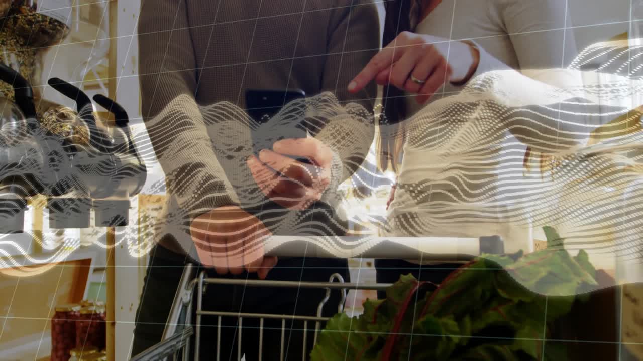 Two shoppers pausing cart using tech scanning produce for details on smartphone wave overlay fading