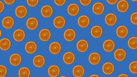 animación de frutas naranja diagonal en fondo azul