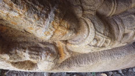 Beautiful-Tracking-Shot-Around-Stone-Figure-on-Ruined-Temple-at-Hampi,-Karnataka,-India