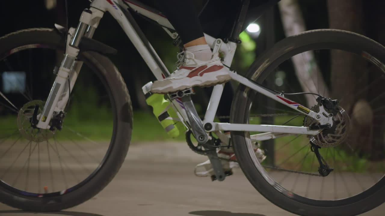 Night City Tranquility, Quiet Urban Park Scene With Water Bottle Near Spinning Wheel At Night, Serene City Park Environment Featuring Water Bottle And Spinning Wheel Illuminated Softly At Night