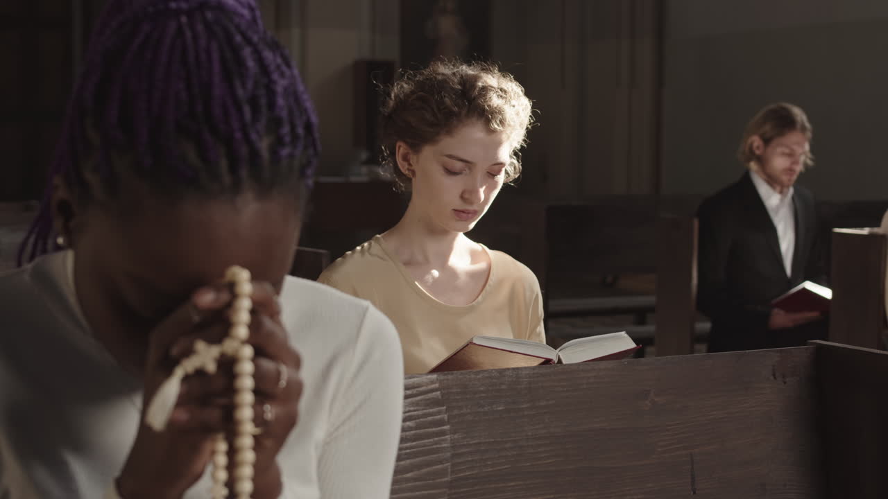 Multiethnic Parishioners Praying Heartily in Lutheran Church