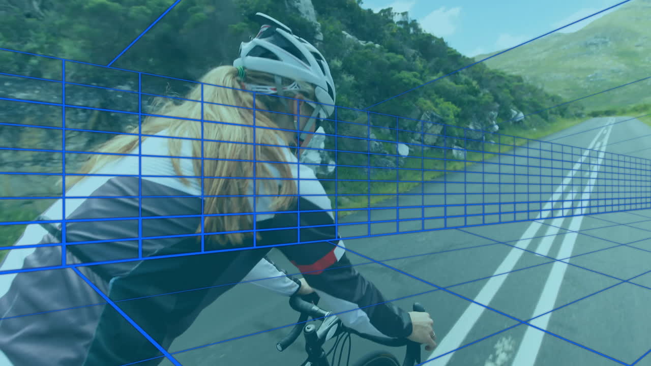 Female cyclist navigating winding mountain road, showing blue wireframe grid overlay for AR mapping