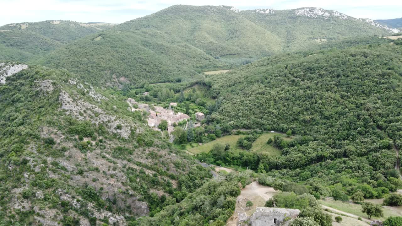 Flying backwards over the village of Termes, France, and Cathar castle