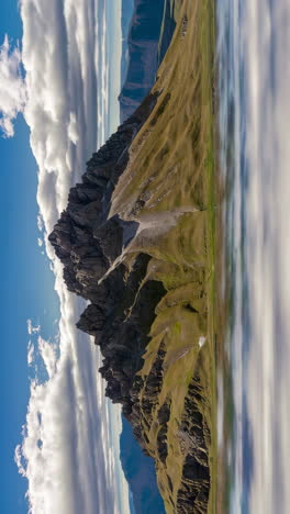 stunning mountain landscape with grassy slopes and clouds