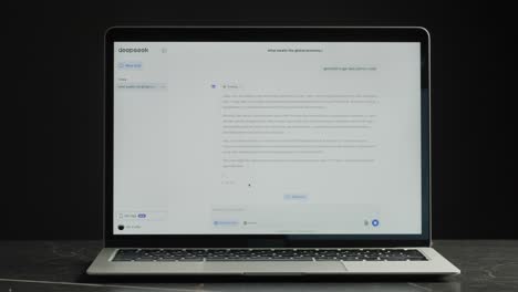 laptop displaying a deepseek webpage with chat and python code