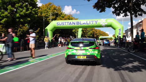 green electric car race at sustainability event