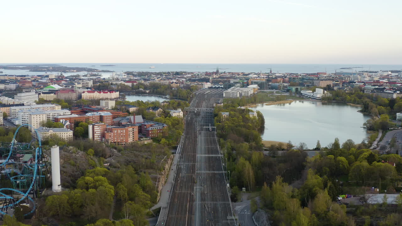 Aerial view of the main railway, the railway station, Toololahti and the downtown Helsinki cityscape, sunny day, in Helsinki, Finland