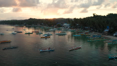 Aerial-view-of-outrigger-boats-at-General-Luna-Harbour-on-Siargao-Island,-Philippines