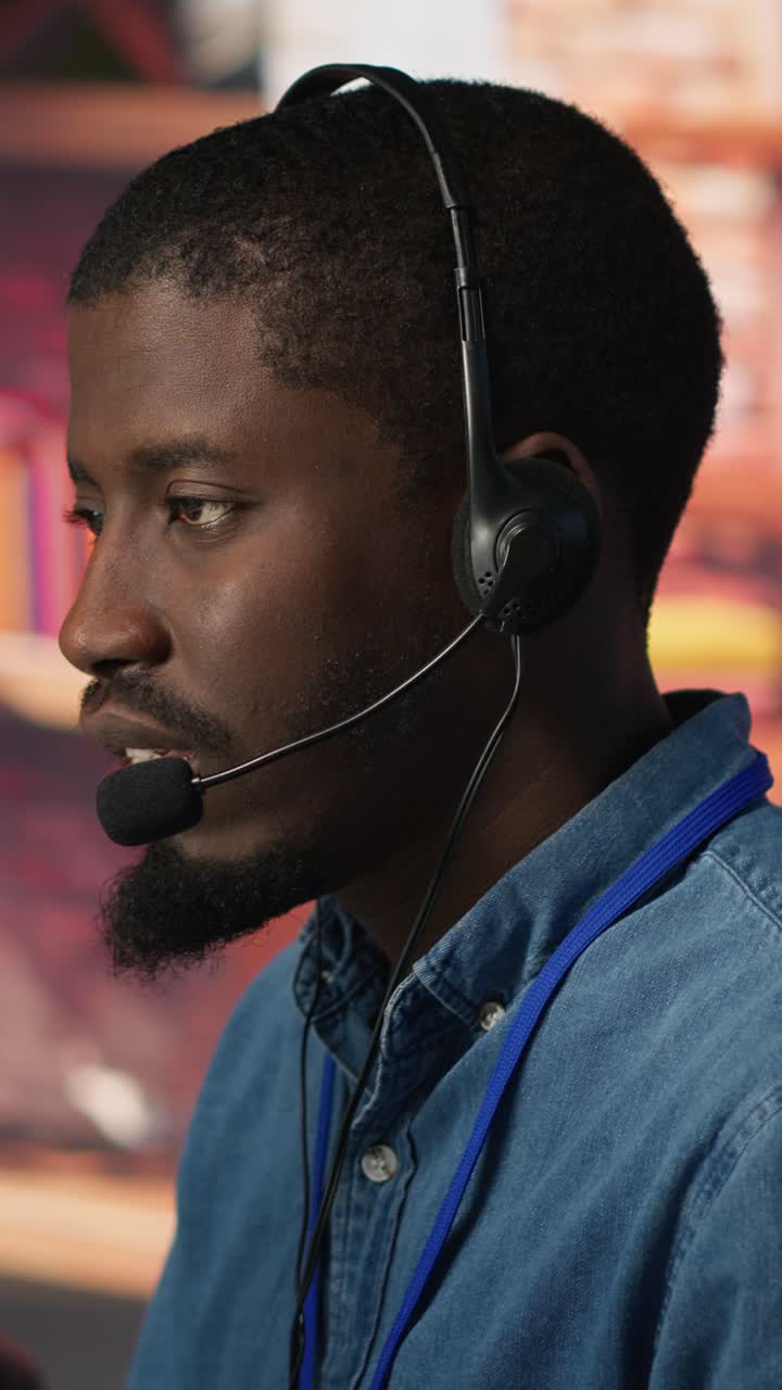 Vertical video Team of multiethnic call center agents in workplace helping customers