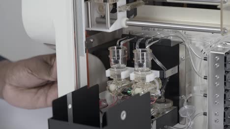 close up of electrode and tubings inside an automatic electrolyte analyzing machine