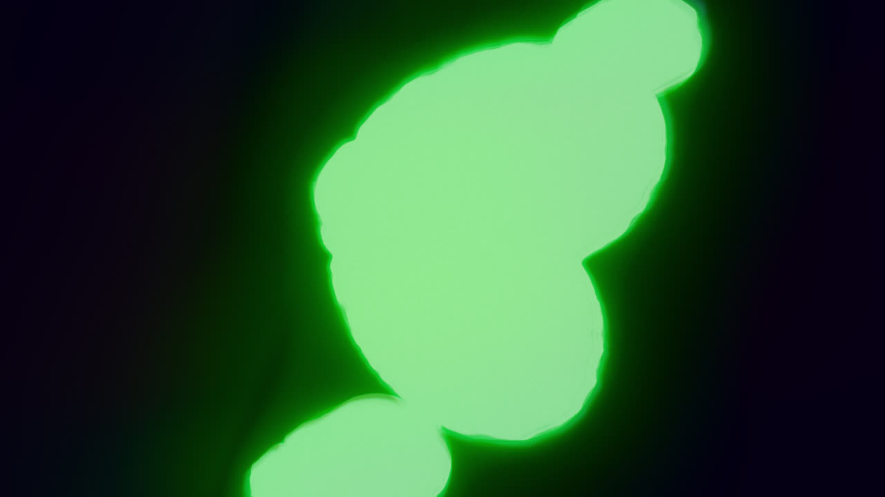 Green energy heart shapes on a dark background