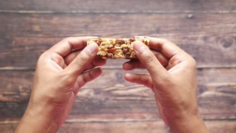 person holding a chocolate energy bar