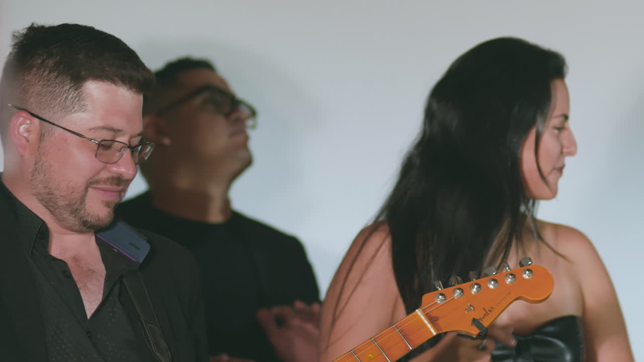 Clip of a musical band performing live at a social event or party.