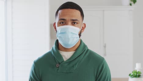 man wearing face mask at home