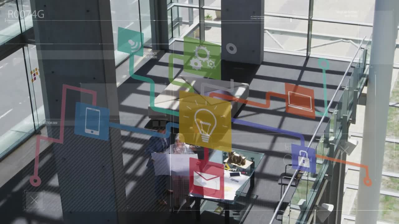 animación de una red de iconos digitales contra una vista aérea de personas que trabajan en la oficina.