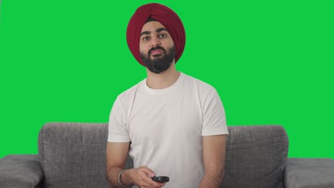 angry sikh indian man indian watching tv green screen