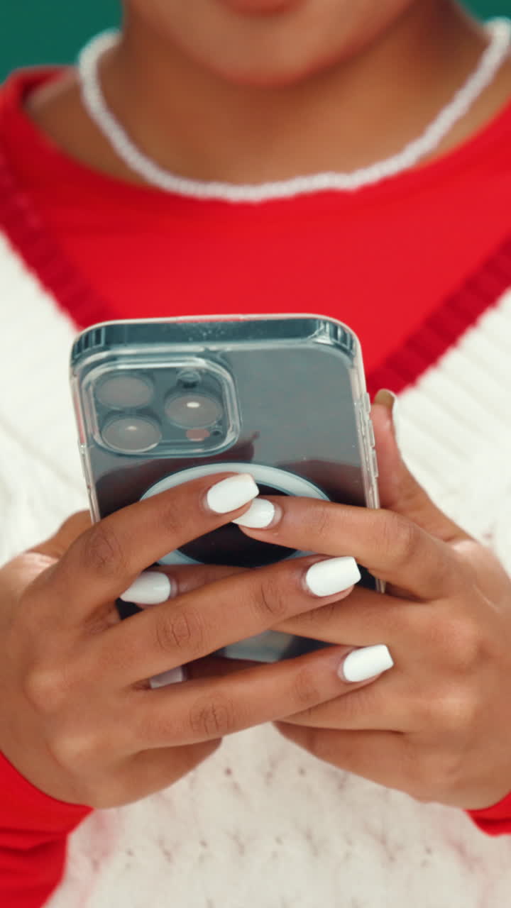 Close-up of Person's Hands Typing on a Smartphone